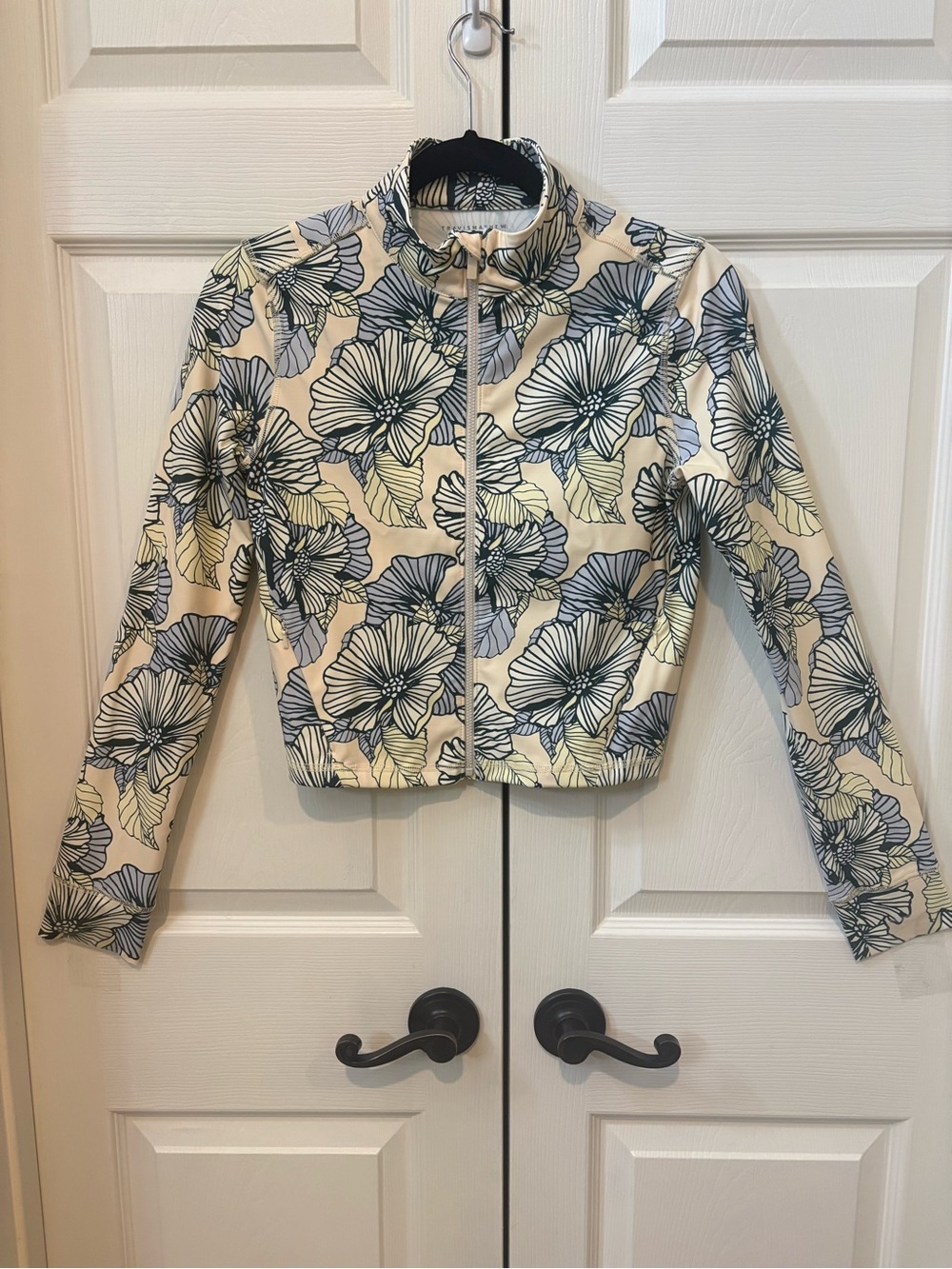 Excellent condition - ladies Travis Mathew Floral Print Zip-Up light jacket.